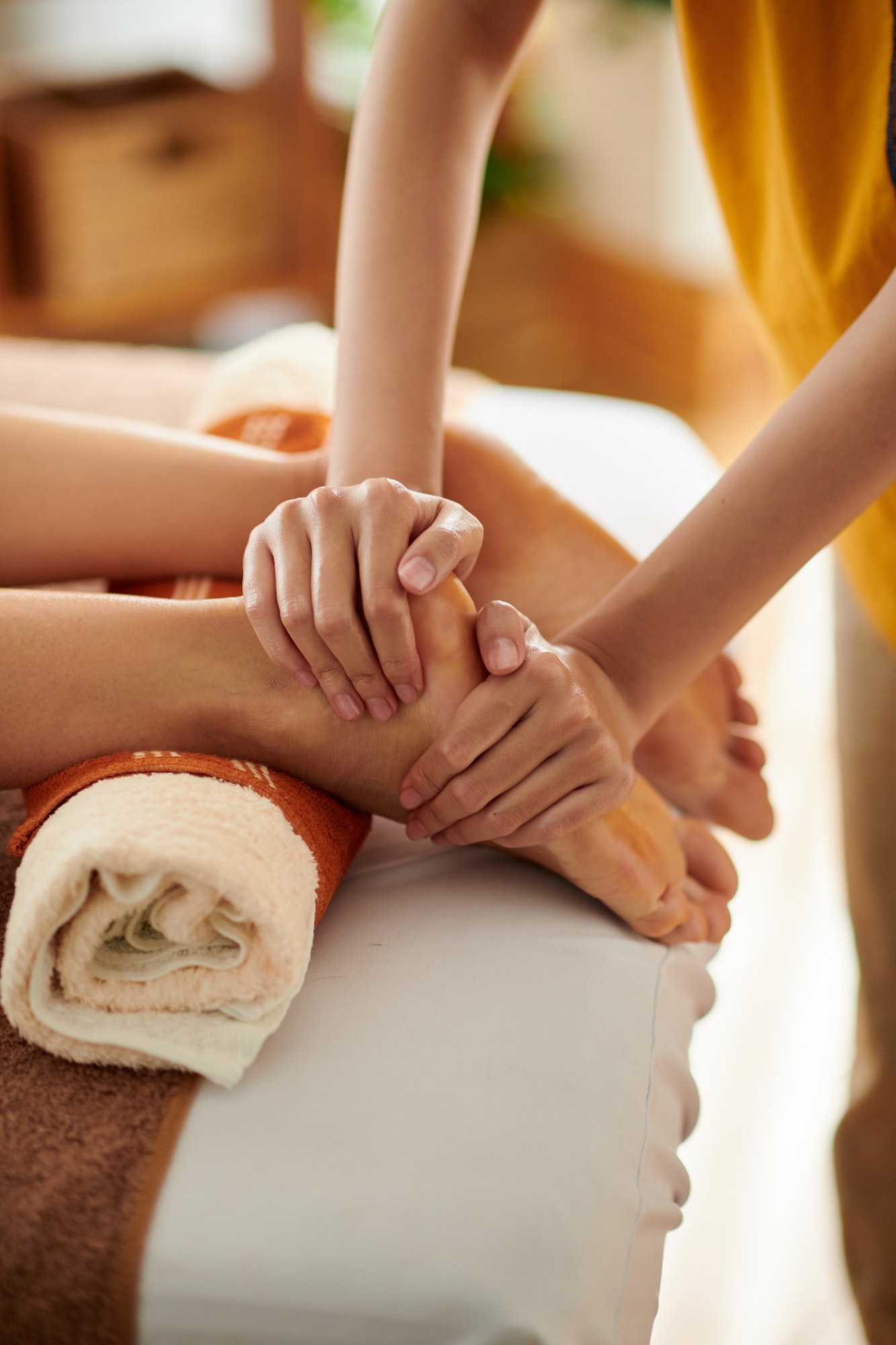Massaging Feet of Female Client
